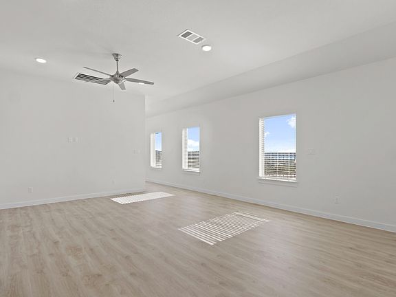 Living Room in the Pecan II home plan by Trophy Signature Homes - REPRESENTATIVE PHOTO