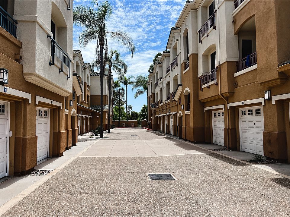 Private drive between apartment with garages at Carmel Heights Apartments in San Diego, California.