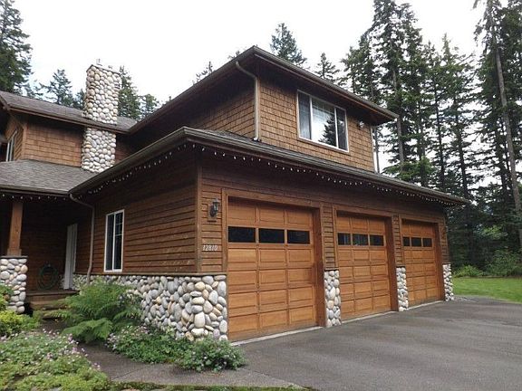 The 3 car extra deep garage allows for storage and with the extra tall doors accommodates most vehic