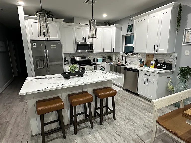 Kitchen with island and to the right- table that expands.