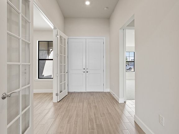 Spacious bright entry foyer with double doors