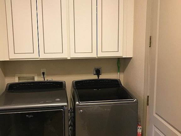 Laundry Room connecting to Garage on middle Floor