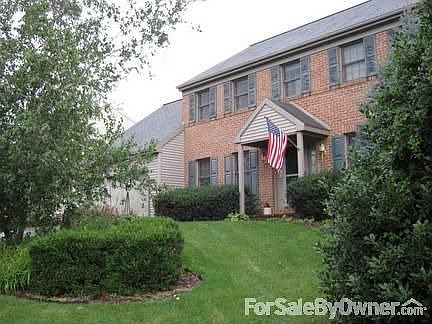 Front of House : Beautiful landscaping with mature trees.