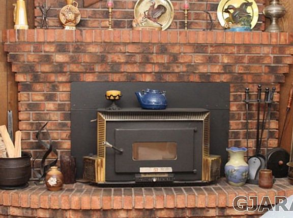 Fireplace with wood stove insert