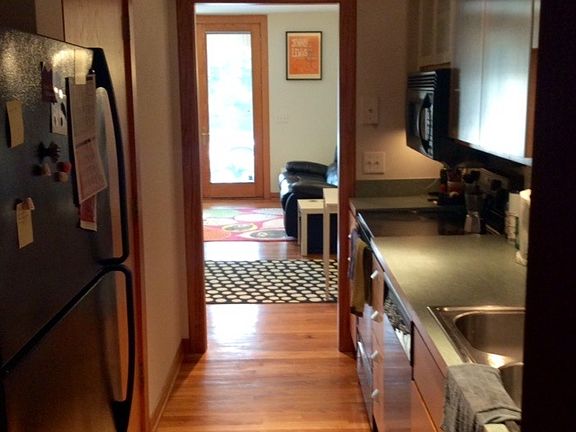 View from galley kitchen looking toward front door