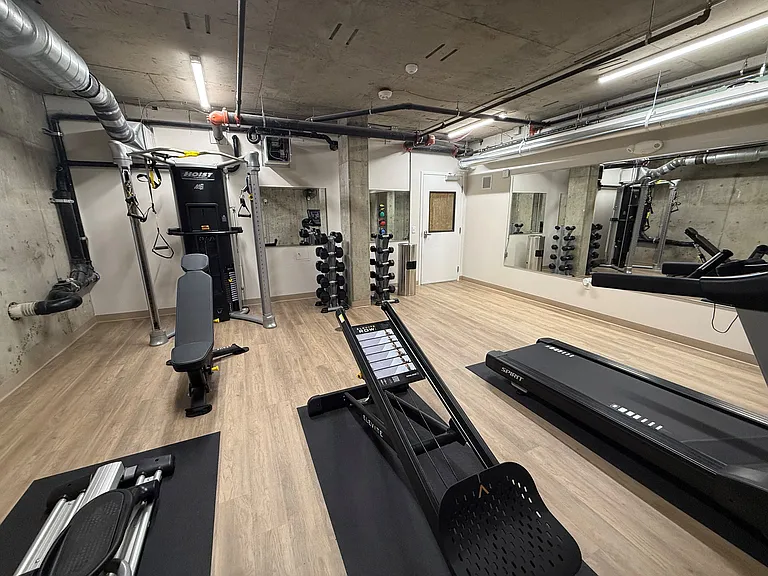 Stay active in the fitness center at Anker Ballard, equipped with treadmills, weight machines, and other exercise equipment.