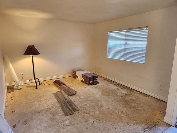 New flooring being installed in living room.
