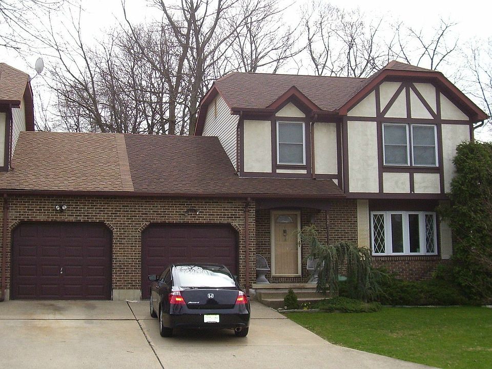 Single Family  Semi Attached at Garage only,  Tudor Style Colonial