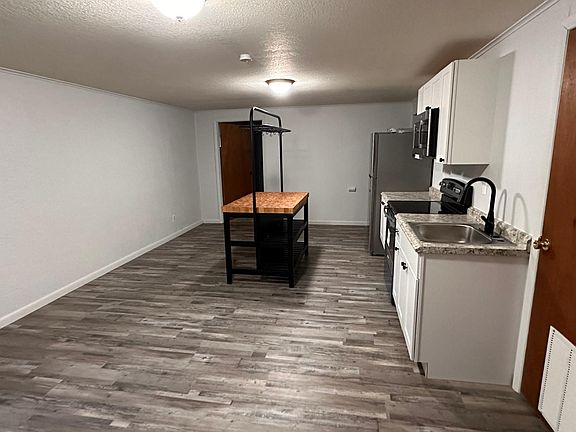 To the right of entering the lower unit