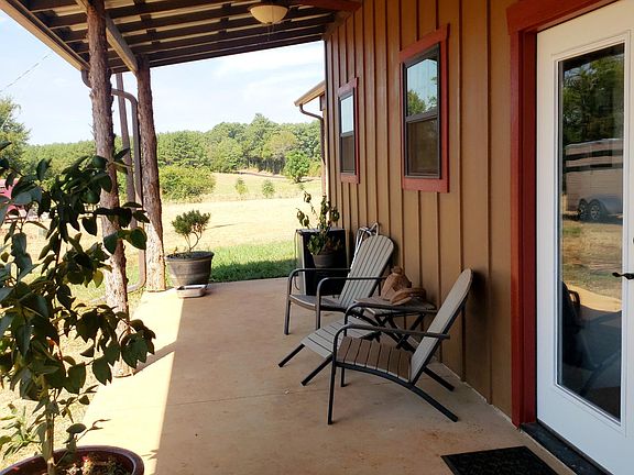 Full length back porch . French door leads to dining/kitchen.