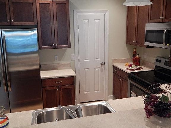 Pantry and nice refrigerator in kitchen
