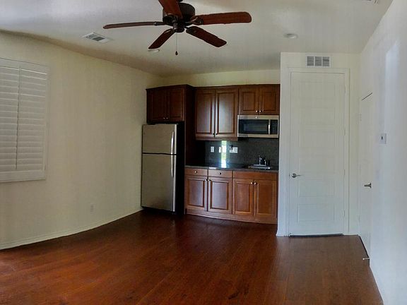 The kitchenette area contains a sink, refrigerator, microwave, toaster oven. !!Does not contain stove
 there is no working stove and no vent.
Ceiling fan for cooling effect.