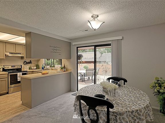 Welcoming kitchen with nice size dining room w/easy access to Deck.  New Dining Room blinds.