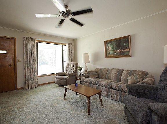 Living room has large windows