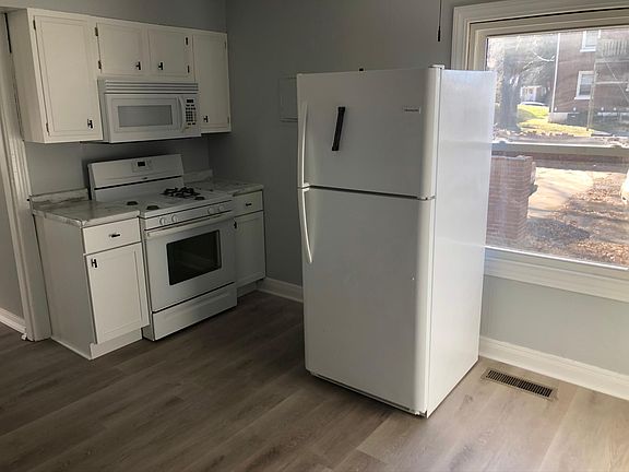 Recently updated kitchen features new cabinets, countertops, and hardwood style flooring. As well as dishwasher, fridge, electric stove and over-the-range microwave.
