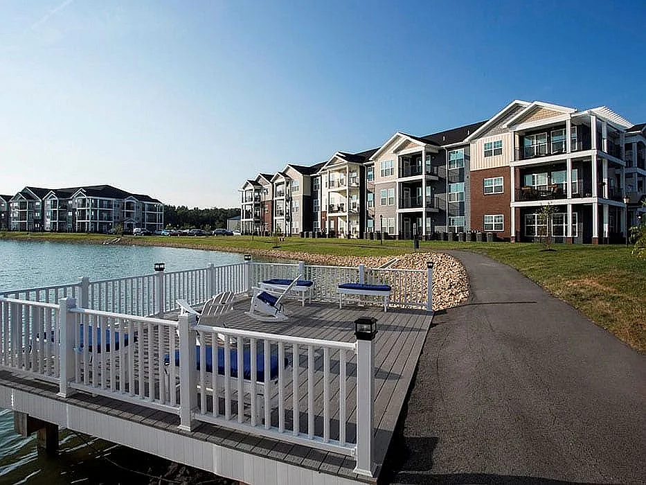 A deck overlooking the pond provides a serene place to relax or fish.