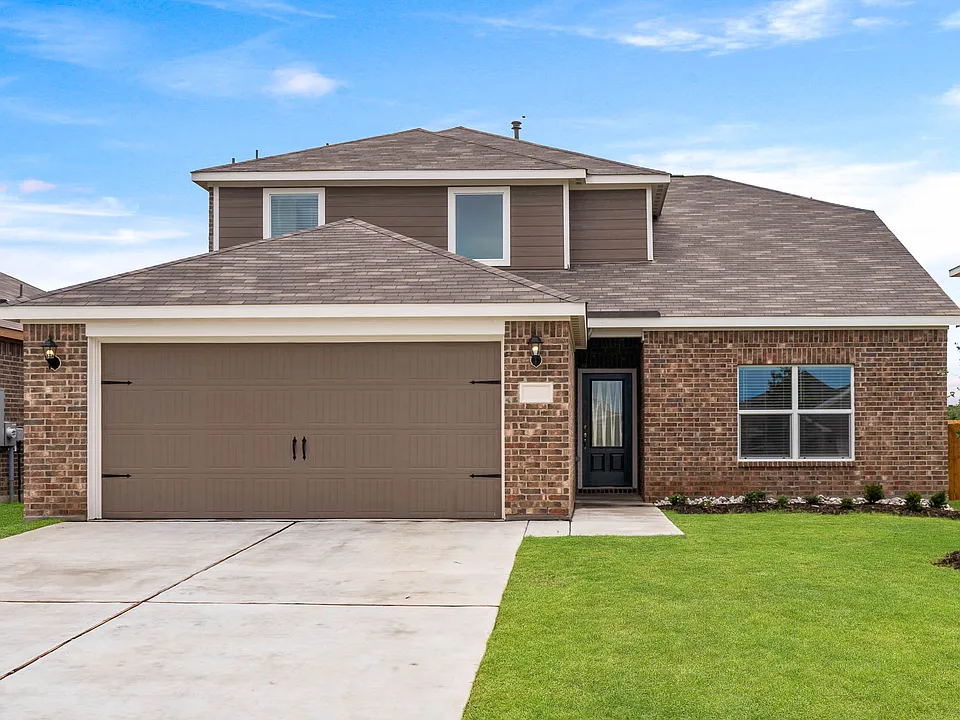 The Cypress is a beautiful two-story floor plan with a brick exterior.