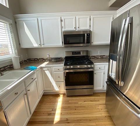 Kitchen with stainless steel appliances less than 3 years old