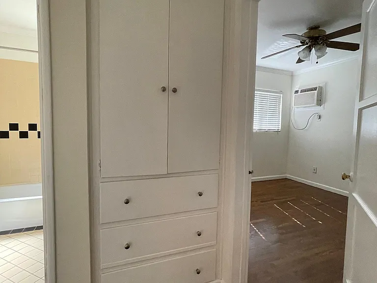 Hallway with built in linen closet