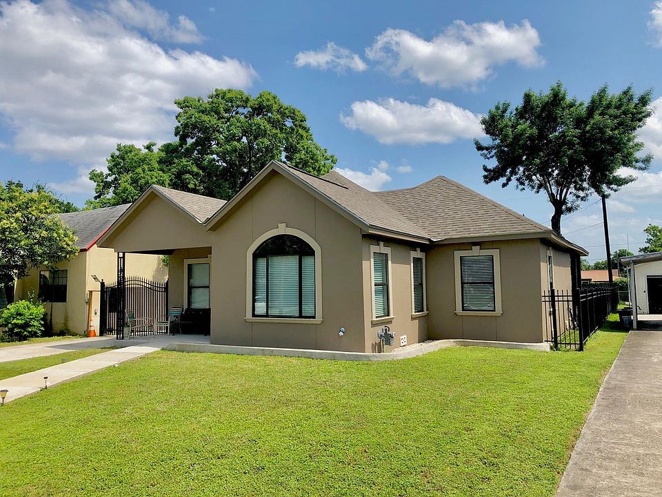 New roof, decorative stucco, electric gate, and lots of windows!