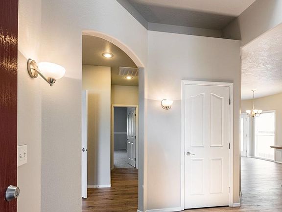 Modern Entry with two tone paint, vaulted ceilings, and high