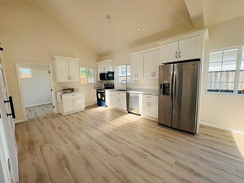 Modern kitchen with stainless steel appliances and granite countertops