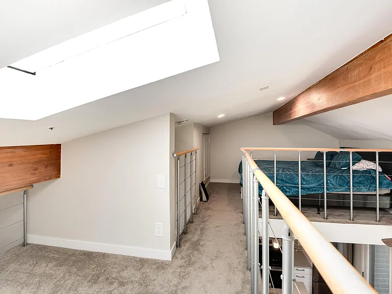 Loft can be used as the primary bedroom space or as an office.