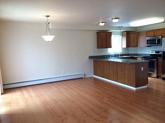 Dining area with breakfast bar and overhead lighting