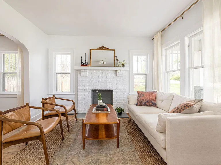 vintage living room, drenched in light! Windows which face south, north, and west serve this room