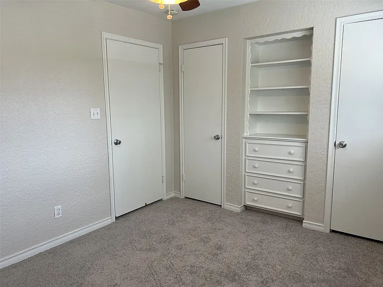 One of three bedrooms on the second level.
