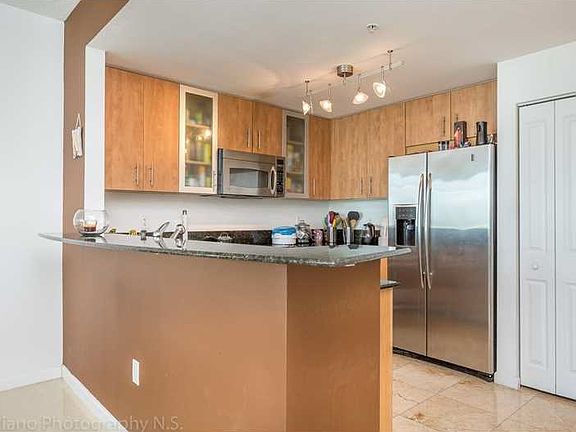 2nd image of 7900 Harbor Island Dr #Townhome