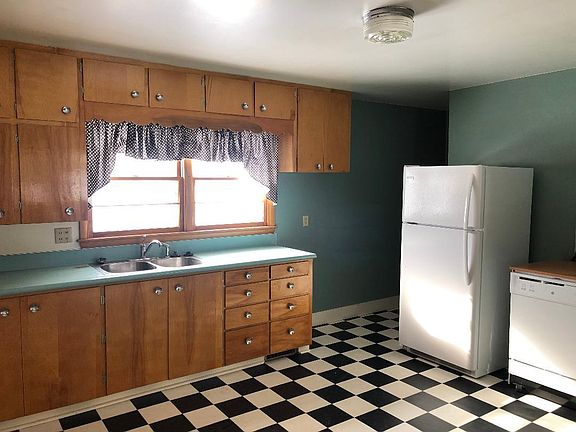 Kitchen with lots of storage, refrigerator, and dishwasher.