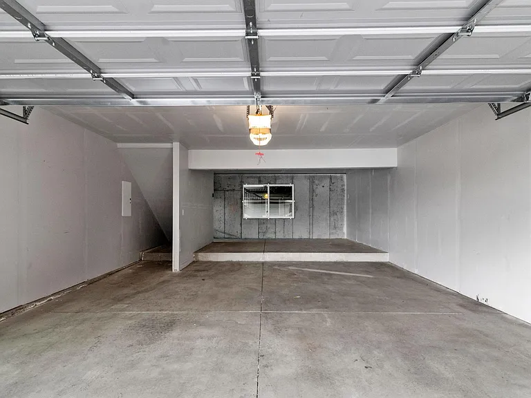 2 car attached garage with extra storage at the front.