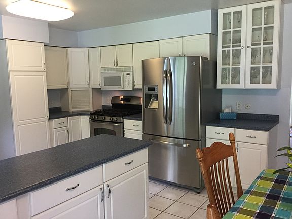 You'll love the kitchen workspace - tons of counters for meal preparation, stainless appliances, ceramic flooring and lots of cabinetry and storage