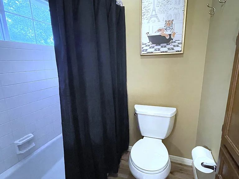 Shower room features shower with adjustable setting showerheads, built-in-storage, ample towels for your short term or 30+ day stay.