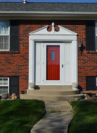 Beautiful front door/storm door with stately millwork!