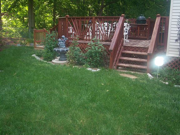 Beautiful side view of deck with bird bath 