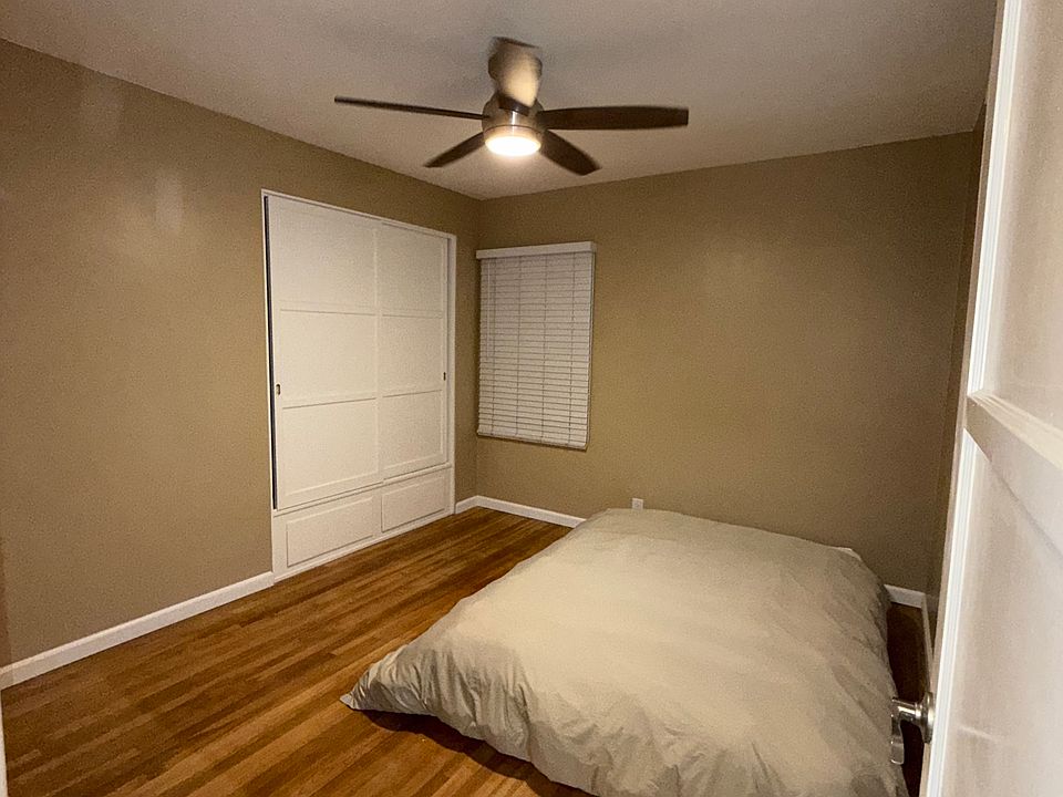 Bedroom with spacious closet and optional queen mattress .