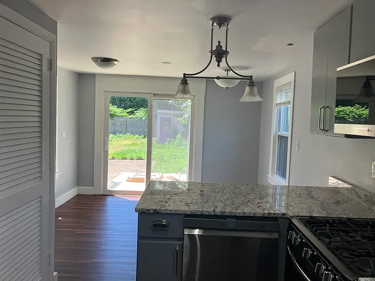 Granite breakfast bar with dishwasher.