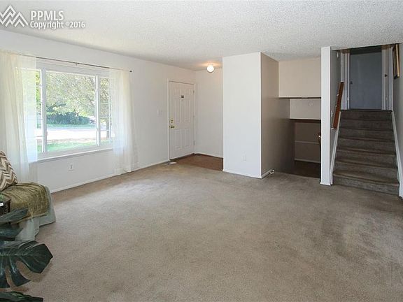 Living room with large window surrounding you in natural light