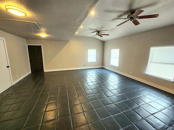 Huge living room with plenty of room for all your furniture and wall space for your TV.