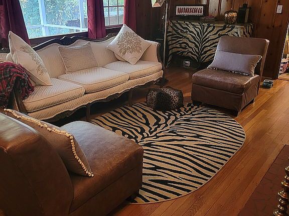 Den with wood burning fireplace