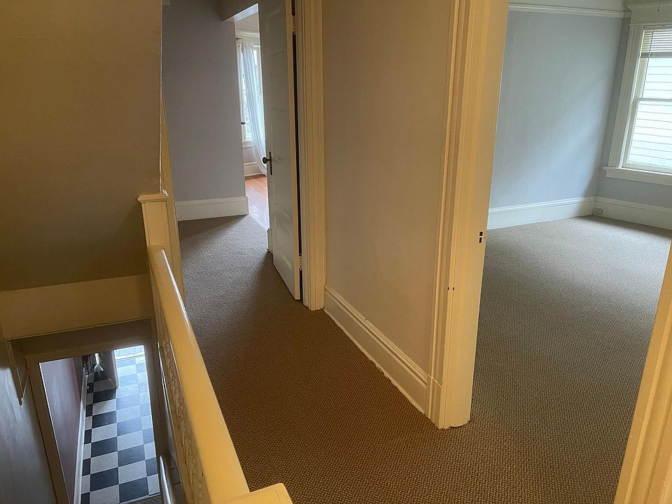 The master bedroom has three windows
and a closet with picture moulding 
 .