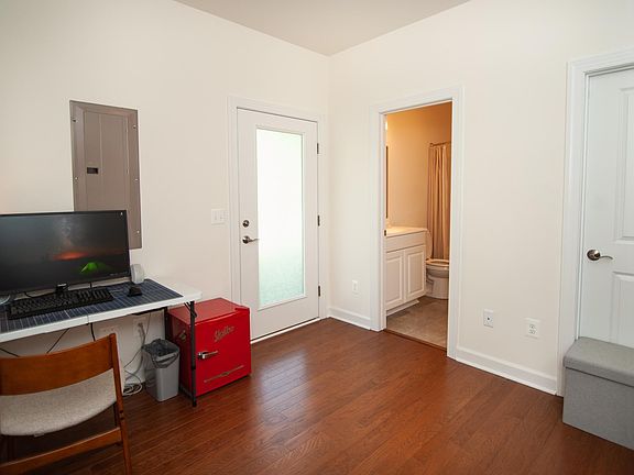 Entry level bedroom, with attached full bath.