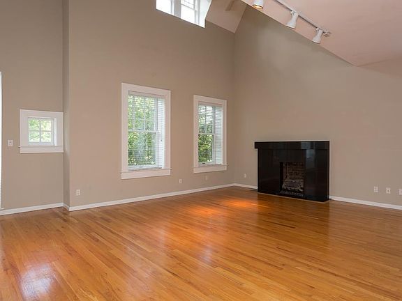 Open Living Room w/ Fireplace and Vaulted Ceilings.

*Fireplace has been upgraded to remote-controlled, direct vent gas fireplace