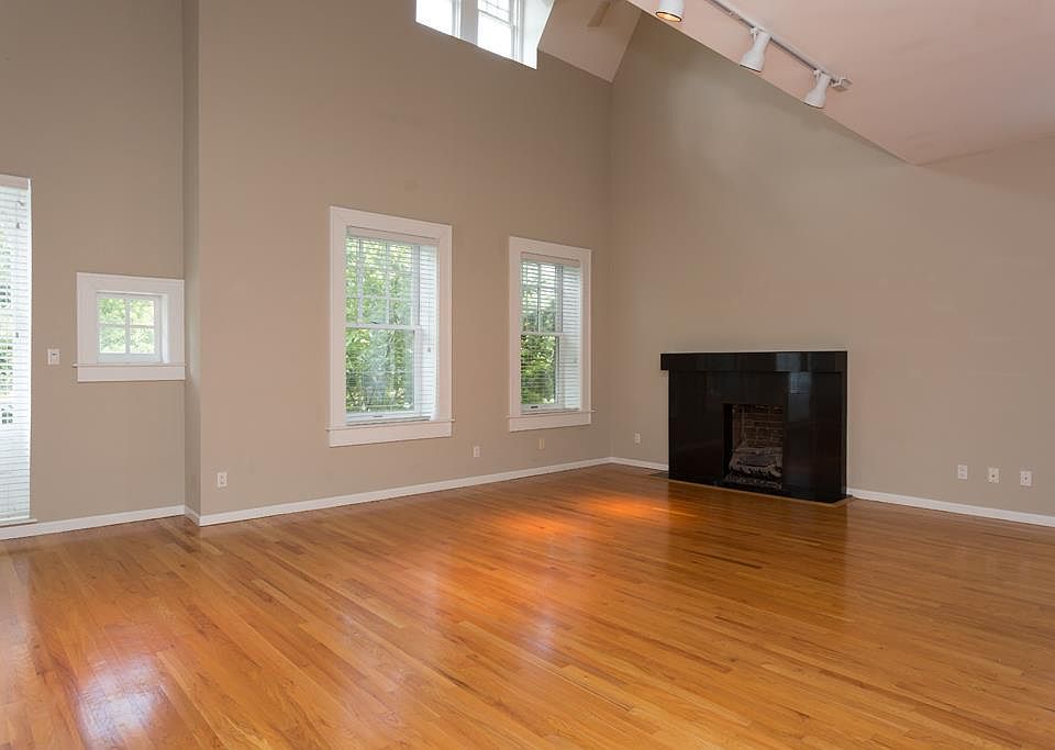 Open Living Room w/ Fireplace and Vaulted Ceilings.

*Fireplace has been upgraded to remote-controlled, direct vent gas fireplace