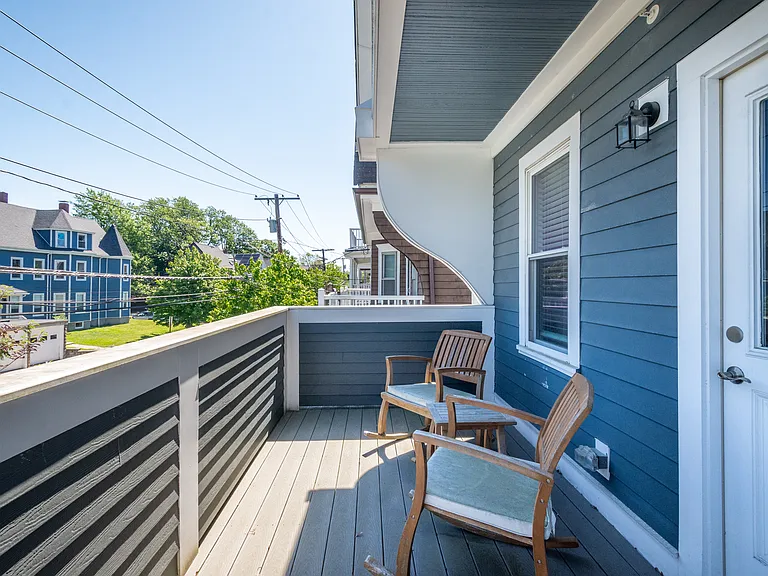 Private front balcony overlooking quiet Morrison Avenue, a low-traffic residential street.