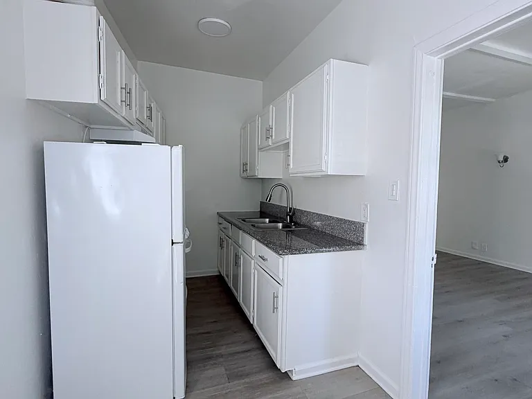looking at kitchen from breakfast area