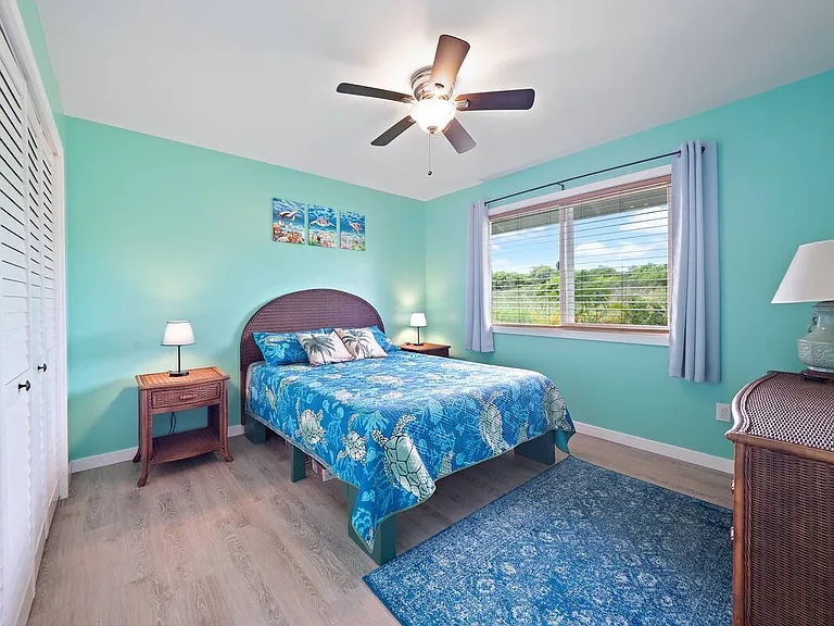 Guest bedroom #2 with queen size bed, larger dresser and closet (not pictured here is a small desk for remote work)