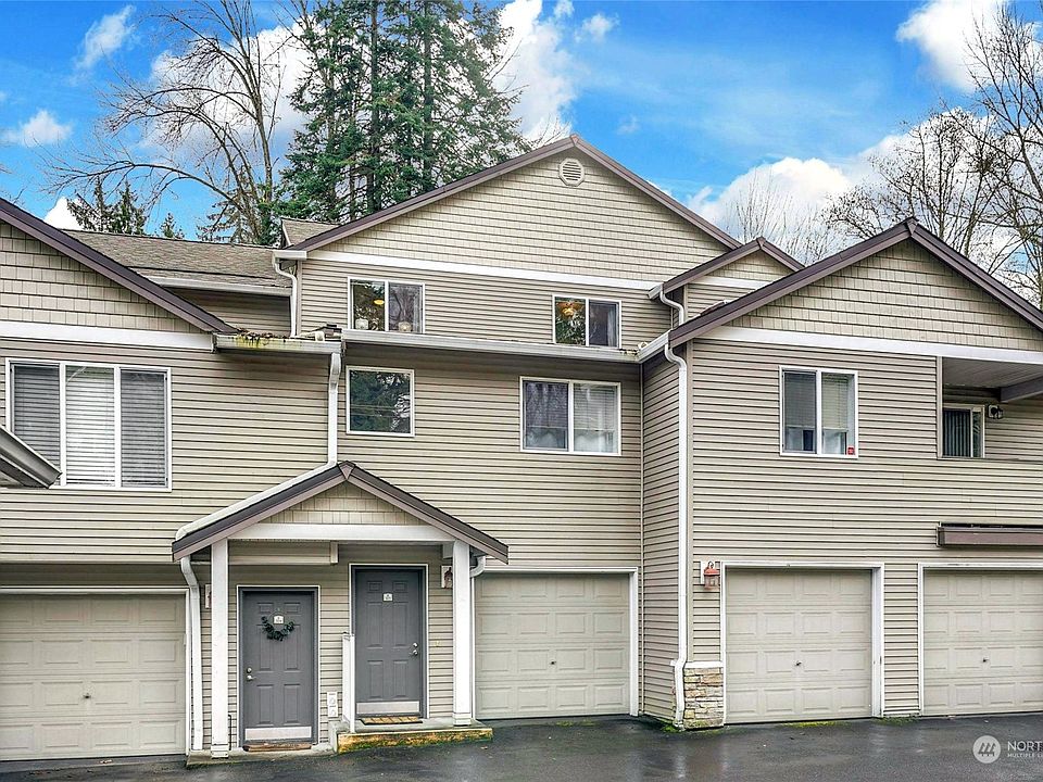 Villa Juanita 3 Story townhome with attached double are garage at ground level.>